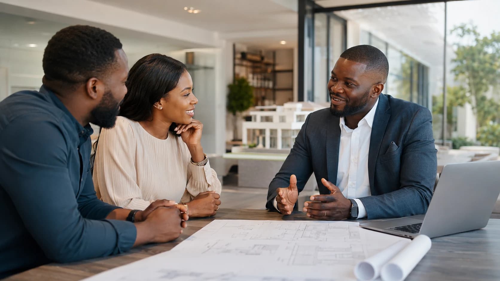 Bernard Builders advisor walking a client through a property consultation in Ghana